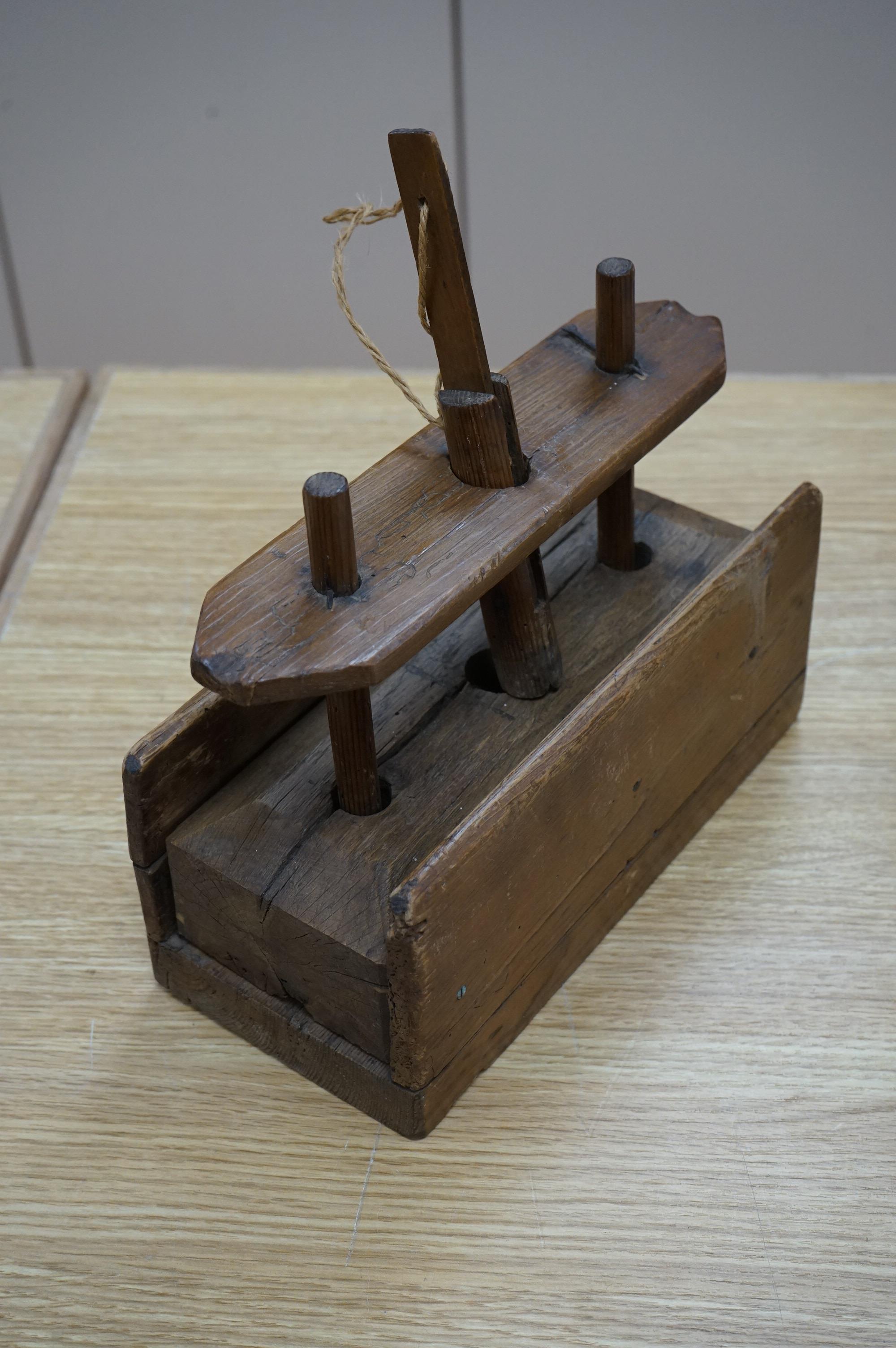 A 19th century provincial wood mouse trap, 25.5cm wide x 28cm high. Condition - some woodworm holes